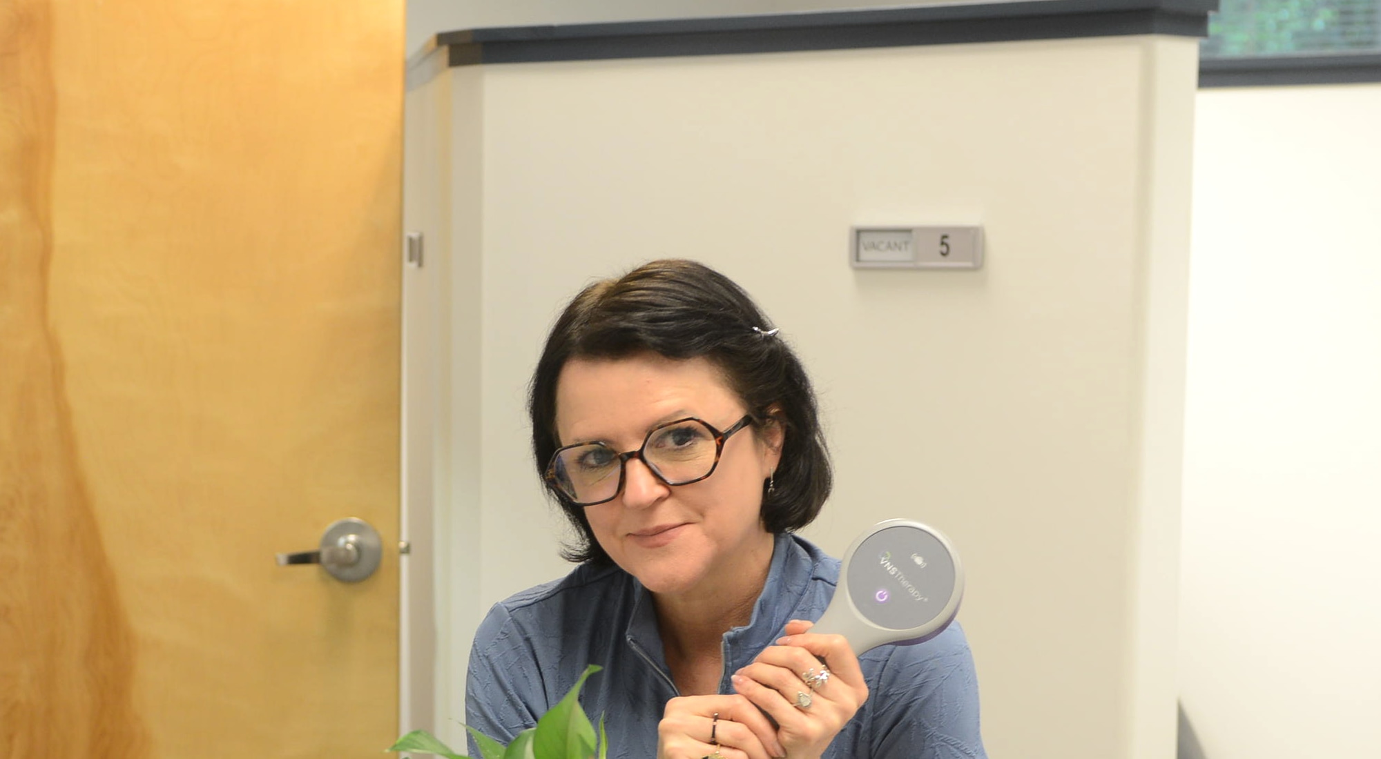 BioMental physician holding a VNS programming wand